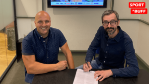 Owen Shackman signing contract paperwork with Sport Buff CEO Benn Achilleas